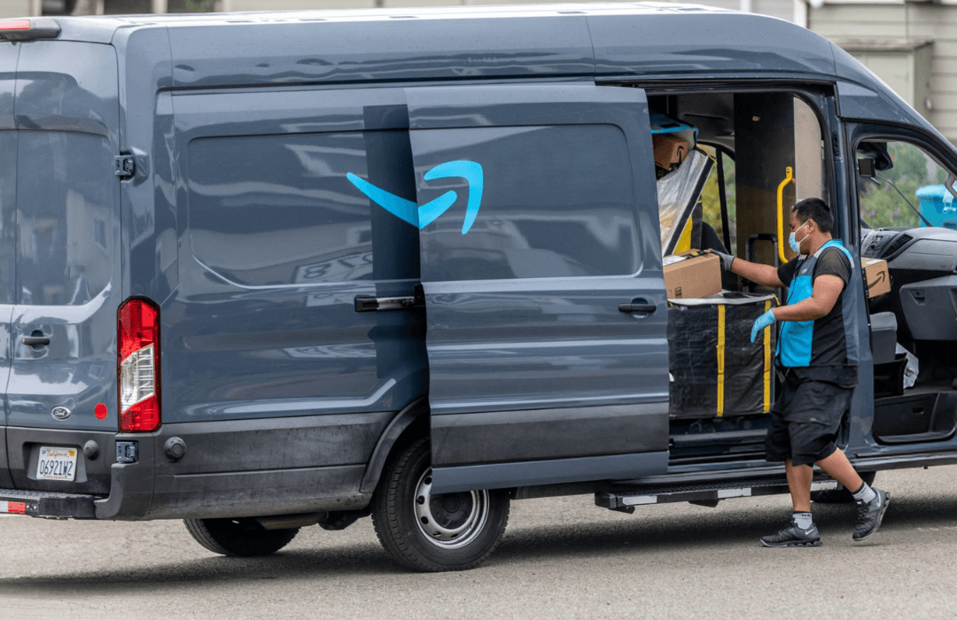 Amazon Flex delivery driver loading packages into a delivery van, illustrating on-the-job injury risks for gig delivery workers.